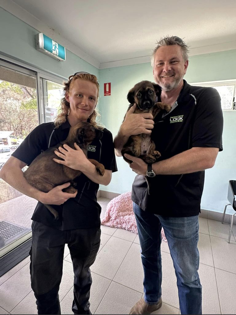 Master Lock Service Staff Portrait holding K9 Rescue Dogs